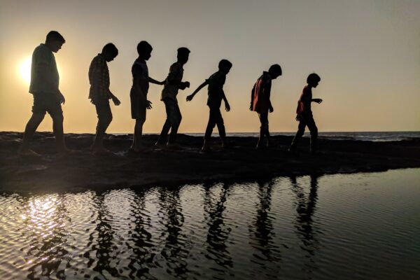 children playing near lake